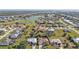 Aerial view of a luxury home community with golf course and water views at 4315 Cape Haze Dr, Placida, FL 33946