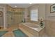 Spa-like bathroom with soaking tub and walk-in shower at 4315 Cape Haze Dr, Placida, FL 33946