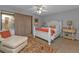 Bright bedroom with white bed frame, coral bedding, and pool view at 4315 Cape Haze Dr, Placida, FL 33946