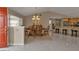 Bright dining room with wooden table and chairs, near kitchen at 4315 Cape Haze Dr, Placida, FL 33946