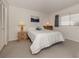 Guest bedroom with full-size bed and wood furniture at 437 Cerromar Ln # 312, Venice, FL 34293