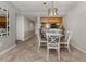 Charming dining area with white table and chairs near the kitchen at 437 Cerromar Ln # 312, Venice, FL 34293