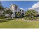 Two-story building with lush landscaping and balconies at 437 Cerromar Ln # 312, Venice, FL 34293