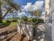 Landscaped yard featuring a low wall and lush greenery at 437 Cerromar Ln # 312, Venice, FL 34293