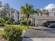 Condo building with carport and landscaping; one car parked at 437 Cerromar Ln # 312, Venice, FL 34293