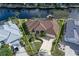 Gorgeous aerial view of the home showcasing well maintained landscaping and a paved driveway at 500 Andora Dr, Punta Gorda, FL 33950