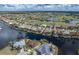 Beautiful aerial view of a home in a waterfront community with deep water access, and a golf course at 500 Andora Dr, Punta Gorda, FL 33950