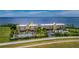 Aerial view of waterfront condo community with tennis courts at 101 N Marion Ct # 133, Punta Gorda, FL 33950