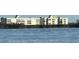 Building exterior showcasing waterfront location, with a unit highlighted at 101 N Marion Ct # 133, Punta Gorda, FL 33950