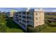 Building exterior showcasing multiple units, balconies, and waterfront views at 101 N Marion Ct # 133, Punta Gorda, FL 33950