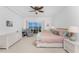 Main bedroom with water views and ceiling fan at 101 N Marion Ct # 133, Punta Gorda, FL 33950