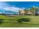 Community tennis court with building in background at 101 N Marion Ct # 133, Punta Gorda, FL 33950