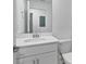 Clean bathroom features a white vanity with a mirror, toilet, and neutral walls at 12470 Wellen Golf St # 203, Venice, FL 34293