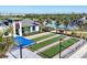 Well-kept bocce ball courts complemented by a community pool and landscaping for leisure at 12470 Wellen Golf St # 203, Venice, FL 34293