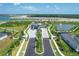 Grand entrance to the community featuring lush landscaping, water features, and controlled access at 12470 Wellen Golf St # 203, Venice, FL 34293