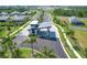 Community entrance featuring contemporary architecture, elegant landscaping, and secure entry at 12470 Wellen Golf St # 203, Venice, FL 34293