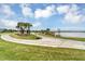 A beautifully landscaped golf course with a lake on the edge of the community at 12470 Wellen Golf St # 203, Venice, FL 34293