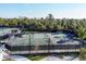 Multiple tennis courts offer an active outdoor lifestyle with well-maintained green surfaces at 12470 Wellen Golf St # 203, Venice, FL 34293