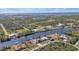 Aerial view of waterfront property with houses and lots at 13449 Palau Cir, Port Charlotte, FL 33953