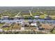 Aerial view of home on canal with private dock at 13449 Palau Cir, Port Charlotte, FL 33953