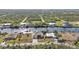 Aerial view showcasing waterfront home and canal at 13449 Palau Cir, Port Charlotte, FL 33953