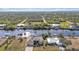 Aerial view of home on the canal, showcasing the neighborhood at 13449 Palau Cir, Port Charlotte, FL 33953