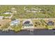 Aerial view of waterfront home with pool and solar panels at 13449 Palau Cir, Port Charlotte, FL 33953