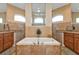 Large bathroom with soaking tub and double vanity at 13449 Palau Cir, Port Charlotte, FL 33953