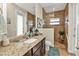 Spa-like bathroom with walk-in shower and granite vanity at 13449 Palau Cir, Port Charlotte, FL 33953