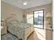 Bedroom with sliding doors opening to canal views at 13449 Palau Cir, Port Charlotte, FL 33953