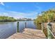 Serene view from the wooden boat dock at 13449 Palau Cir, Port Charlotte, FL 33953