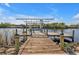 Private wooden boat dock with lift at 13449 Palau Cir, Port Charlotte, FL 33953