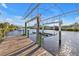 Covered boat lift on private dock at 13449 Palau Cir, Port Charlotte, FL 33953