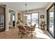 Kitchen breakfast nook with wicker chairs and glass table, pool view at 13449 Palau Cir, Port Charlotte, FL 33953