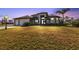 Attractive single-story home with a large front yard and two-car garage at 13449 Palau Cir, Port Charlotte, FL 33953