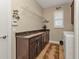 Laundry room with granite countertop, ample cabinet space, and shelving at 13449 Palau Cir, Port Charlotte, FL 33953