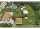 Aerial view of a home with detached workshop and large yard at 1713 Belvidere Rd, Englewood, FL 34223