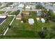 House with a large yard and detached shed, aerial view at 1713 Belvidere Rd, Englewood, FL 34223