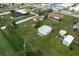 Aerial view of a home with detached garage and large lot at 1713 Belvidere Rd, Englewood, FL 34223