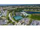 Wide shot of community, pool, tennis courts, and lake at 2061 Willow Hammock Cir # 204, Punta Gorda, FL 33983