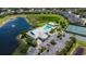 Community pool, tennis courts, and parking area at 2061 Willow Hammock Cir # 204, Punta Gorda, FL 33983