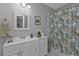 Clean bathroom with white vanity, shower/tub combo, and patterned shower curtain at 2061 Willow Hammock Cir # 204, Punta Gorda, FL 33983