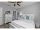 Charming bedroom with a white bed frame and light decor at 2061 Willow Hammock Cir # 204, Punta Gorda, FL 33983