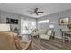 Living room with hardwood floors and access to balcony at 2061 Willow Hammock Cir # 204, Punta Gorda, FL 33983