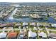 Aerial view of waterfront homes with private docks and lush landscaping at 2199 El Cerito Ct, Punta Gorda, FL 33950