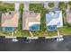 Aerial view of houses with pools and canal views at 2199 El Cerito Ct, Punta Gorda, FL 33950