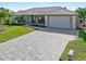 Single-Gathering home with paver driveway and mature landscaping at 2199 El Cerito Ct, Punta Gorda, FL 33950