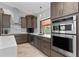 Well-equipped kitchen featuring dark cabinetry and stainless steel appliances at 2199 El Cerito Ct, Punta Gorda, FL 33950