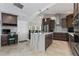 Modern kitchen featuring dark cabinetry, quartz countertops, and stainless steel appliances at 2199 El Cerito Ct, Punta Gorda, FL 33950