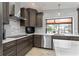 Sleek kitchen with stainless steel appliances and quartz countertops at 2199 El Cerito Ct, Punta Gorda, FL 33950